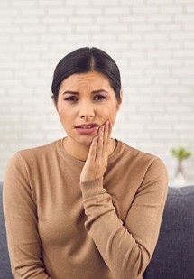 woman pointing to inflamed gums 